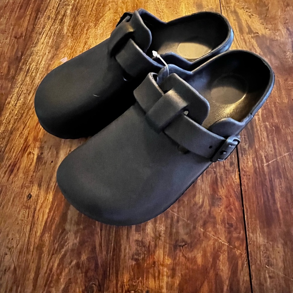 Black Mules with Adjustable Strap and Durable Sole